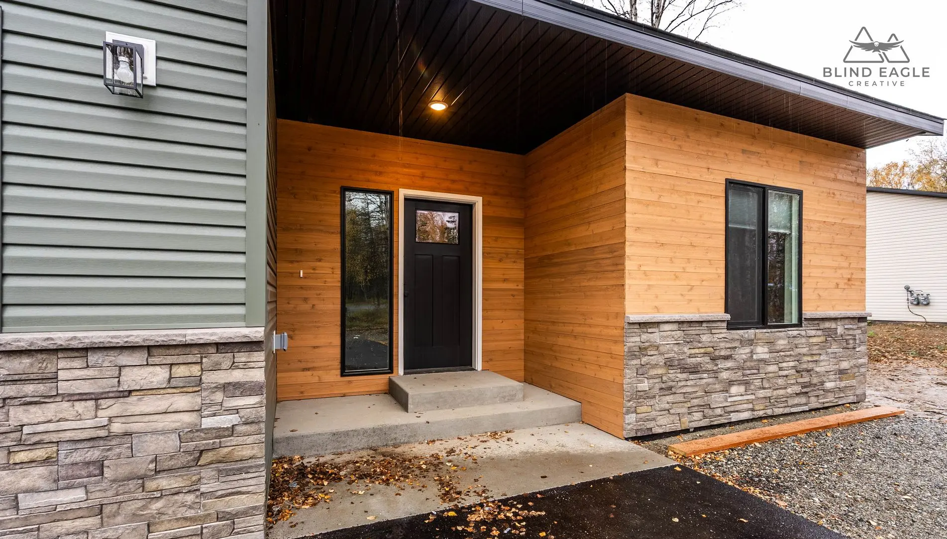 Covered cedar entryway of a newly built Alaska rental home